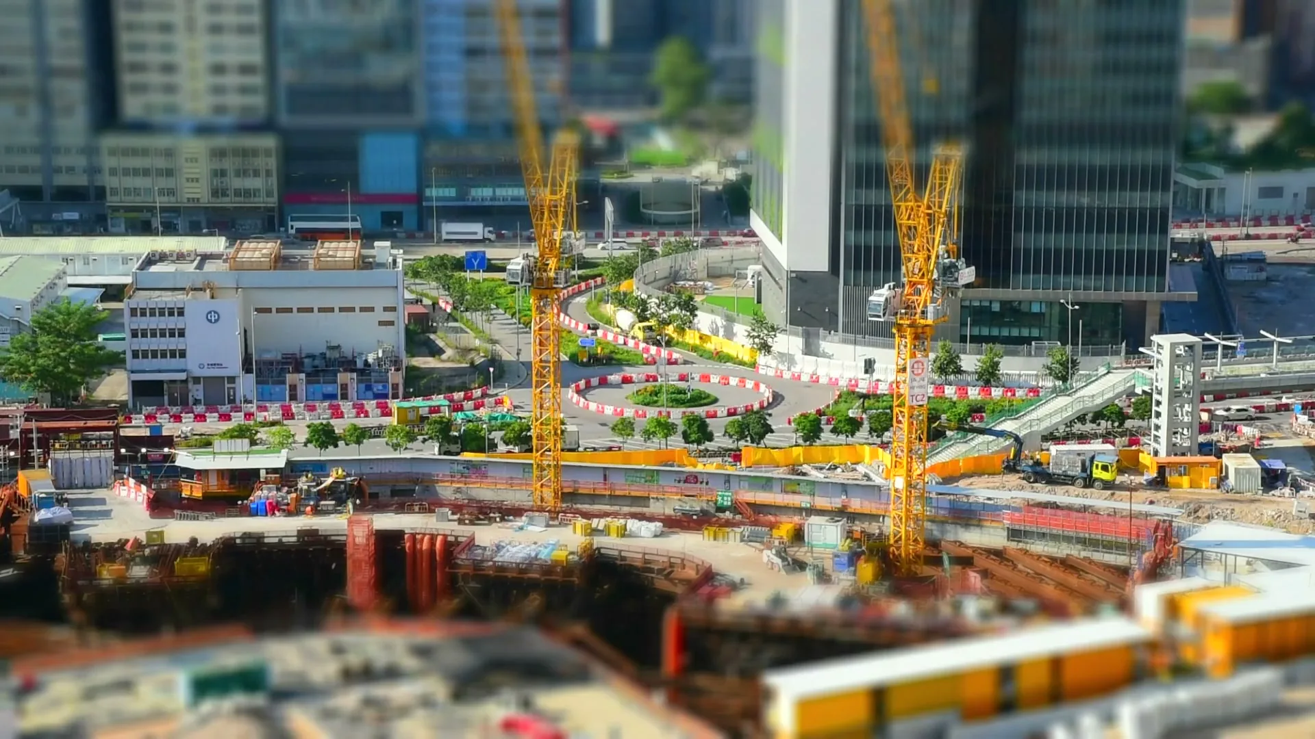 Illustrative view of cranes and excavation within an urban construction site
